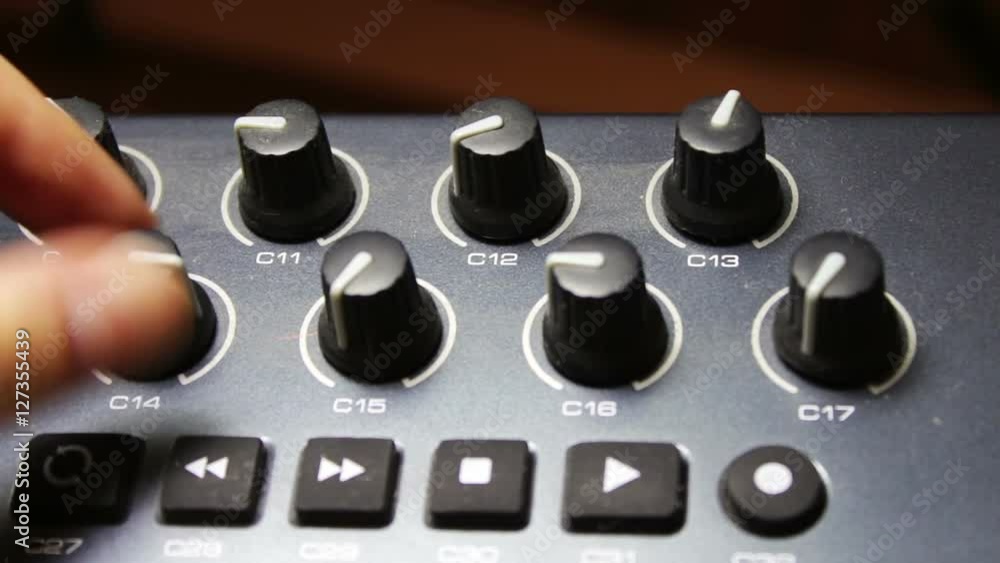 female hand tunes midi synthesizer keyboard female hand tunes midi synthesizer keyboard