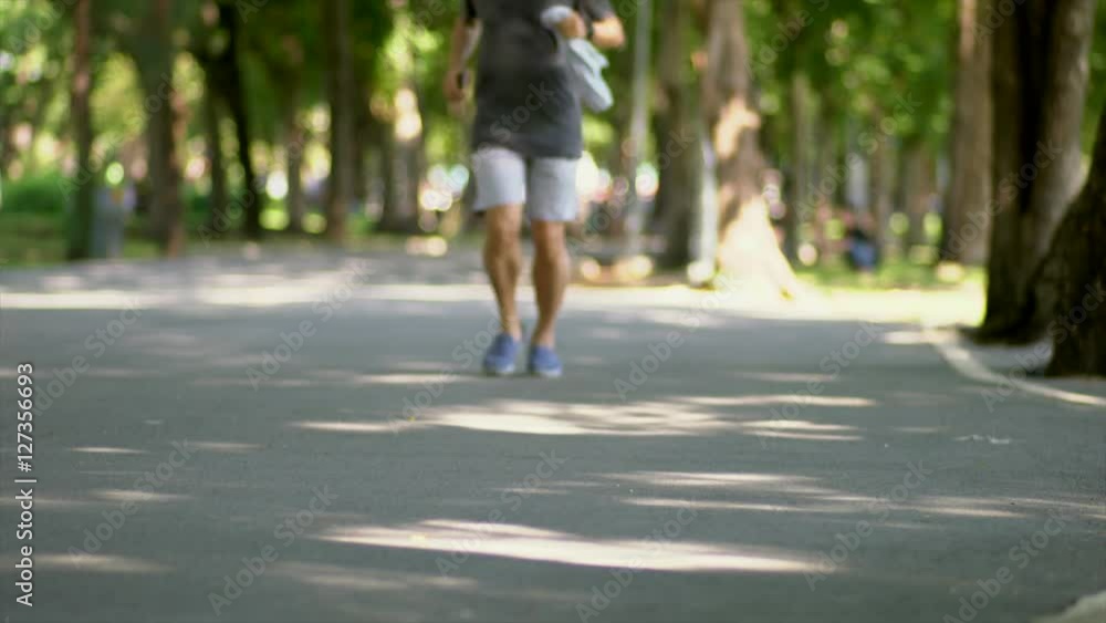 People jogging In the Park, shallow DOF, low angle view People jogging In the Park, shallow DOF, low angle view