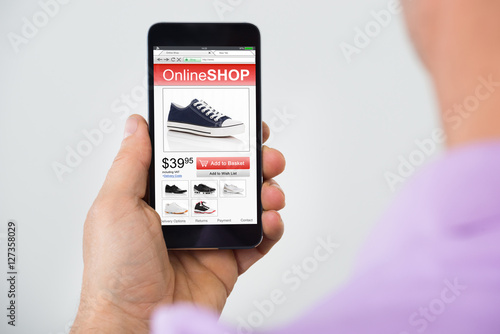Person Shopping Online On Mobilephone