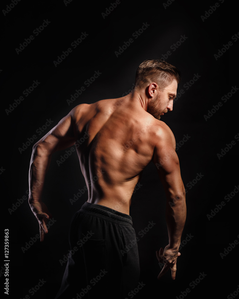 Bodybuilder Posing. Back muscles. Bodybuilder Posing. Back muscles.