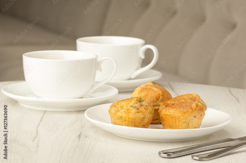 cake and two cups of coffee on a table with cutlery cake and two cups of coffee on a table with cutlery