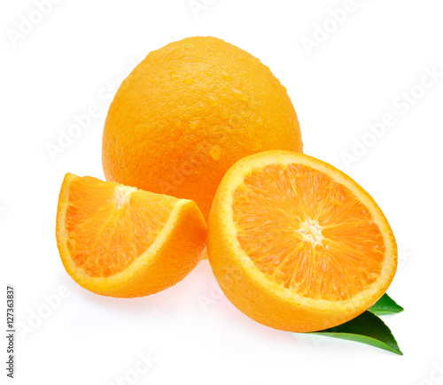 fresh orange fruit and leaf with drops of water isolated on whit