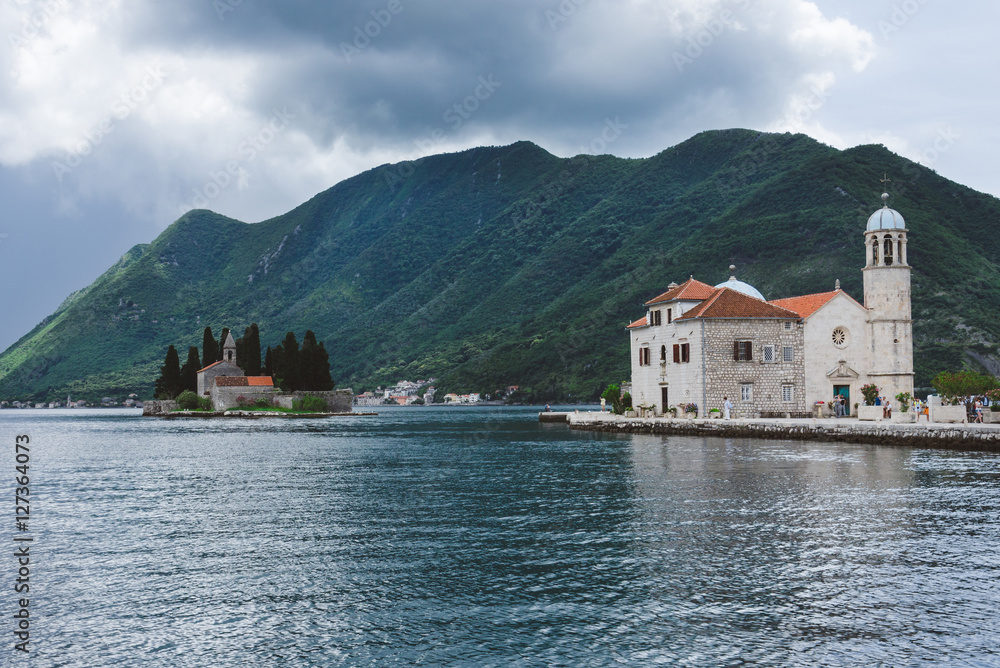 Our Lady Of The Rocks and Saint George islets near Perast on Kotor Bay. Saint George Benedictian monastery and Roman Catholic Church of Our Lady Of the Rocks are situated on the islands.