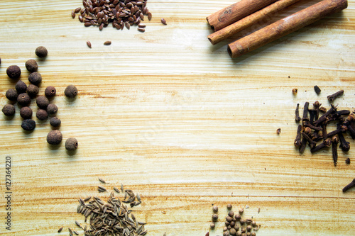 spices on a wooden background, place for text