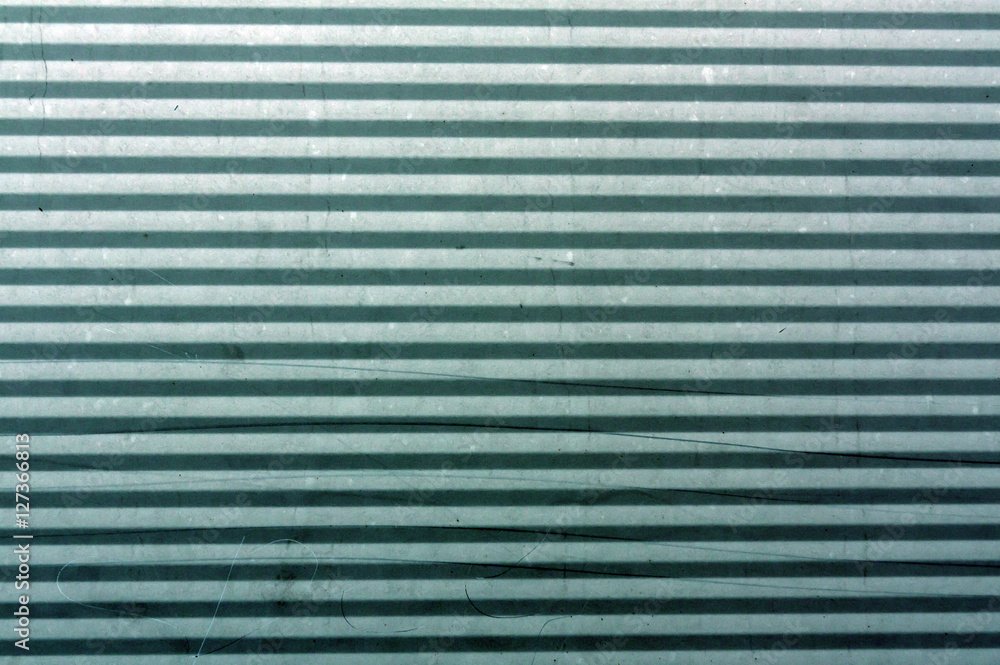 Fototapeta premium Cyan toned Corrugated metal plate surface.