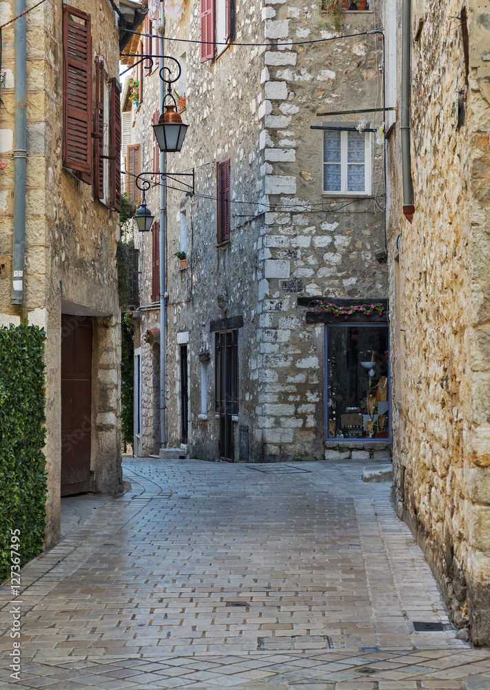 Narrow cobbled street in old village Vence , France.