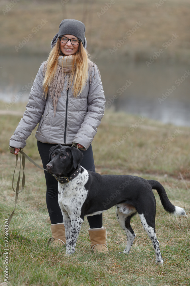 girl with a dog for a walk in the autumn girl with a dog for a walk in the autumn