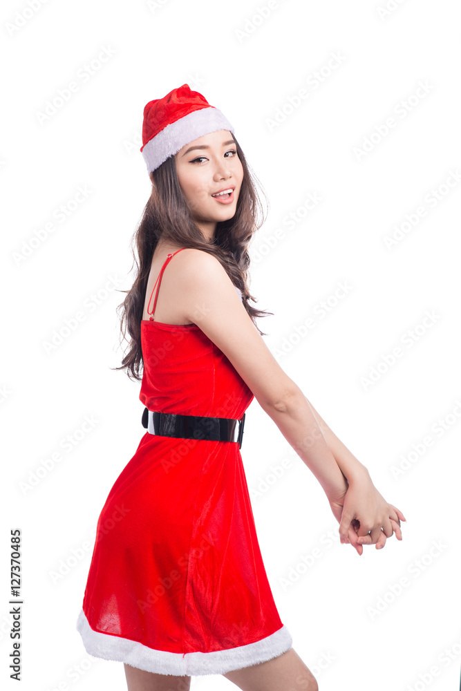Christmas Woman. Beauty Asian Model Girl in Santa Hat isolated o Christmas Woman. Beauty Asian Model Girl in Santa Hat isolated o