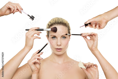 many hands putting on makeup