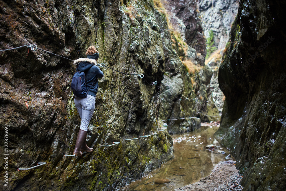 Woman hiker in a canyon Woman hiker in a canyon