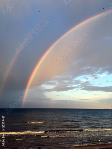Colorful rainbow over Black Sea beach