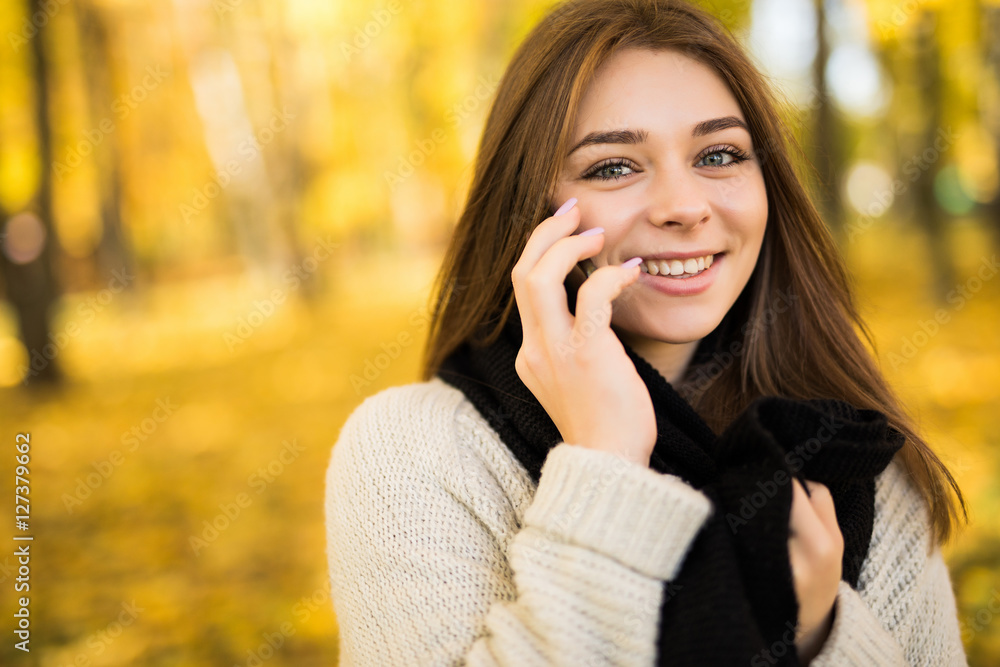 Portrait of girl speak on phone in sunny autumn park Portrait of girl speak on phone in sunny autumn park