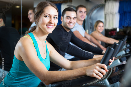 Adults training on treadmills