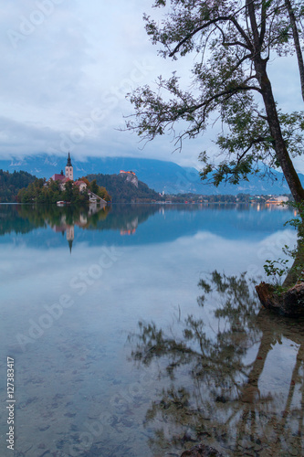 Lake Bled and the island with the church at autumn color at sunset in Slovenia