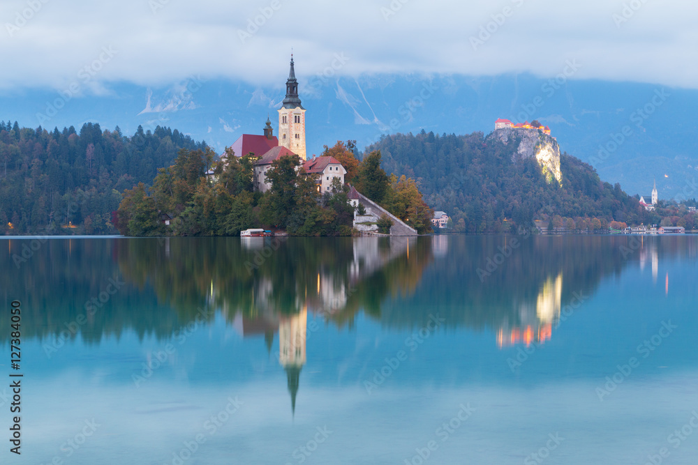 Lake Bled and the island with the church at autumn color at sunset in Slovenia