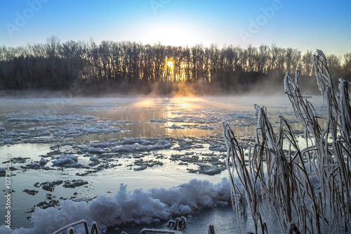 Sunrise during freeze-up in the river