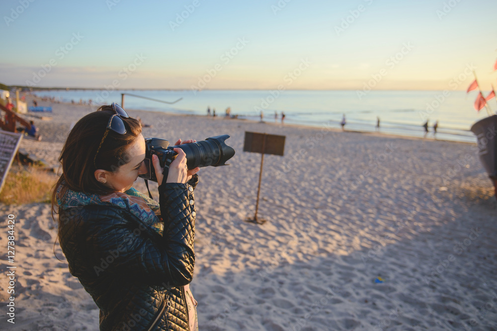 professional woman photographer on the beach professional woman photographer on the beach