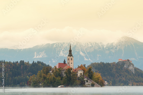 Lake Bled and the island with the church at autumn color at sunset in Slovenia