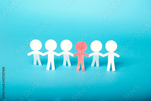A group of red and white paper people