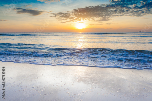 Fototapeta Naklejka Na Ścianę i Meble -  Bright sunrise over on the beach