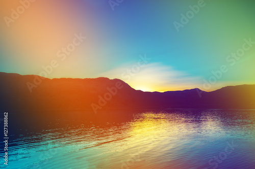 Fjord at sunset  Rocky beach in evening. Silhouette of rocks against colorful sunset sky. Lofoten  Norway