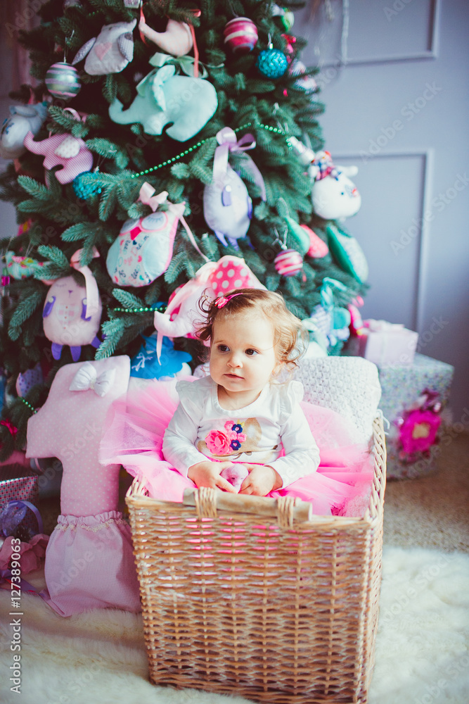 The small girl sits in basket The small girl sits in basket