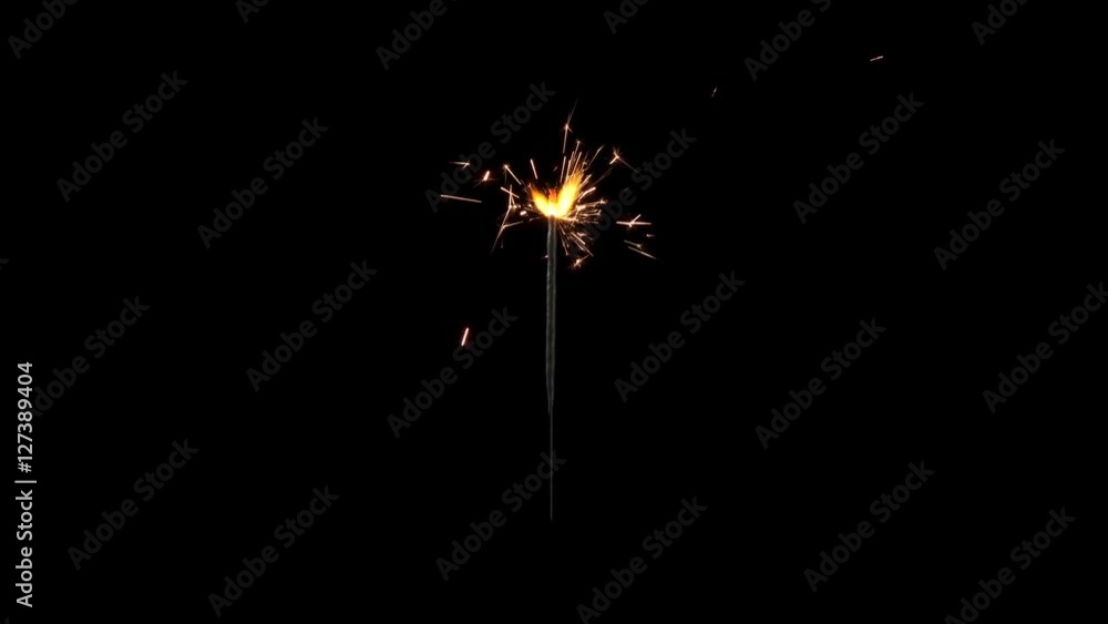 Centrally positioned firework sparkler burning from start to end in real time isolated. Full size uncropped expanded frame. Gun powder sparks shot against deep dark background. Centrally positioned firework sparkler burning from start to end in real time isolated. Full size uncropped expanded frame. Gun powder sparks shot against deep dark background.