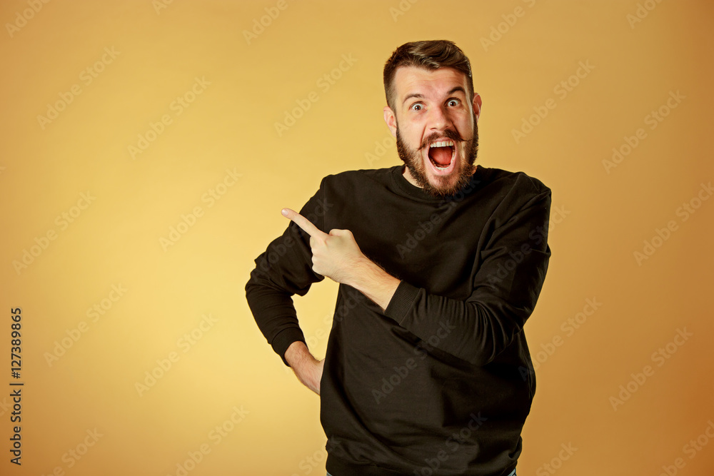 Portrait of young man with shocked facial expression Portrait of young man with shocked facial expression