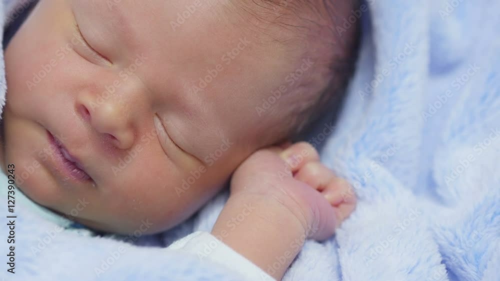 Newborn baby sleeps. Sleeping newborn baby in blanket.
Newborn baby sleeps. Sleeping newborn baby in blanket.
