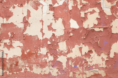 The old red cement plaster on the wall