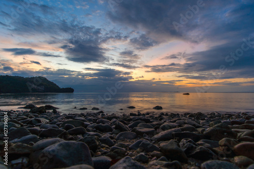 Beautiful sun set light and rock beach © tonaquatic
