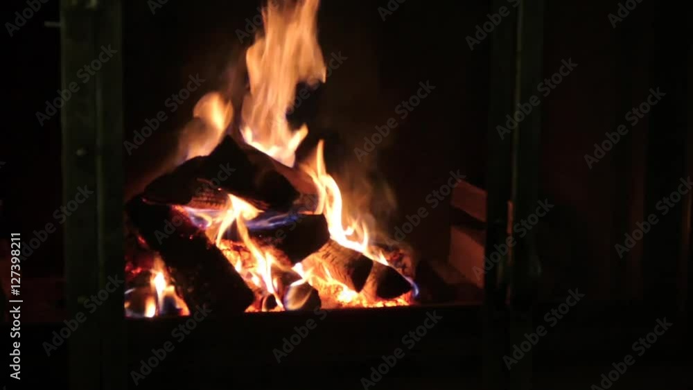 burning firewood in a fireplace burning firewood in a fireplace