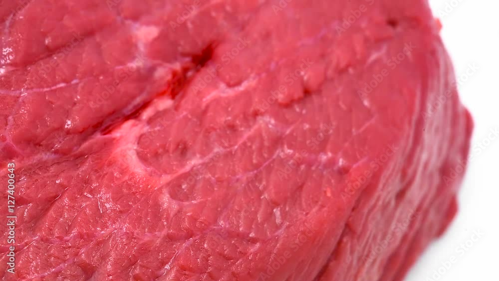 Rotating beef meat at white isolated background Rotating beef meat at white isolated background