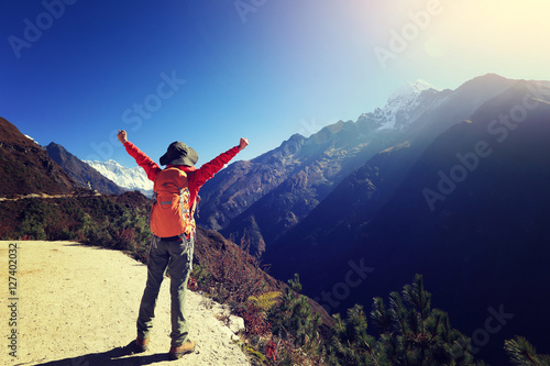 woman backpacker trekking at the himalaya mountains