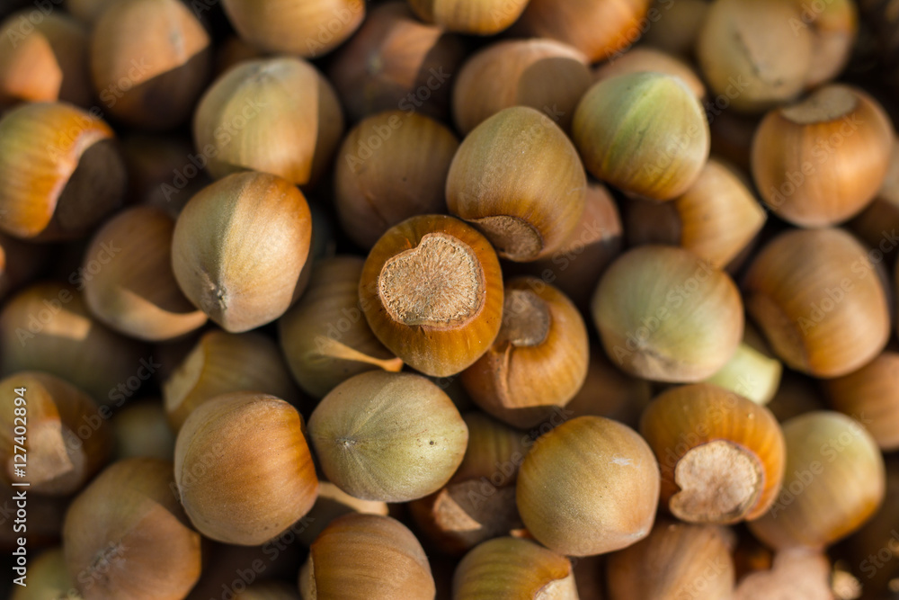 A basket of toasted hazelnuts inviting A basket of toasted hazelnuts inviting