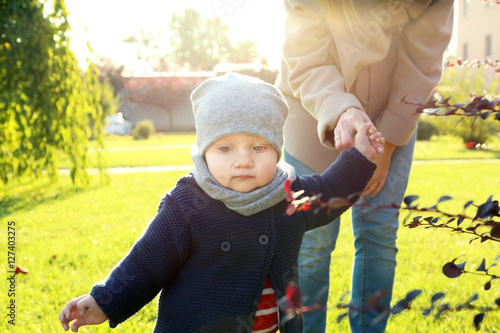 Cute little baby with mothe...