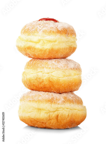 Stack of tasty donuts on white background. Hanukkah celebration concept