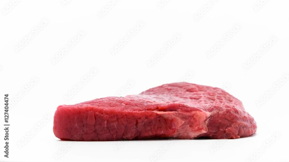 Rotating beef meat at white isolated background Rotating beef meat at white isolated background