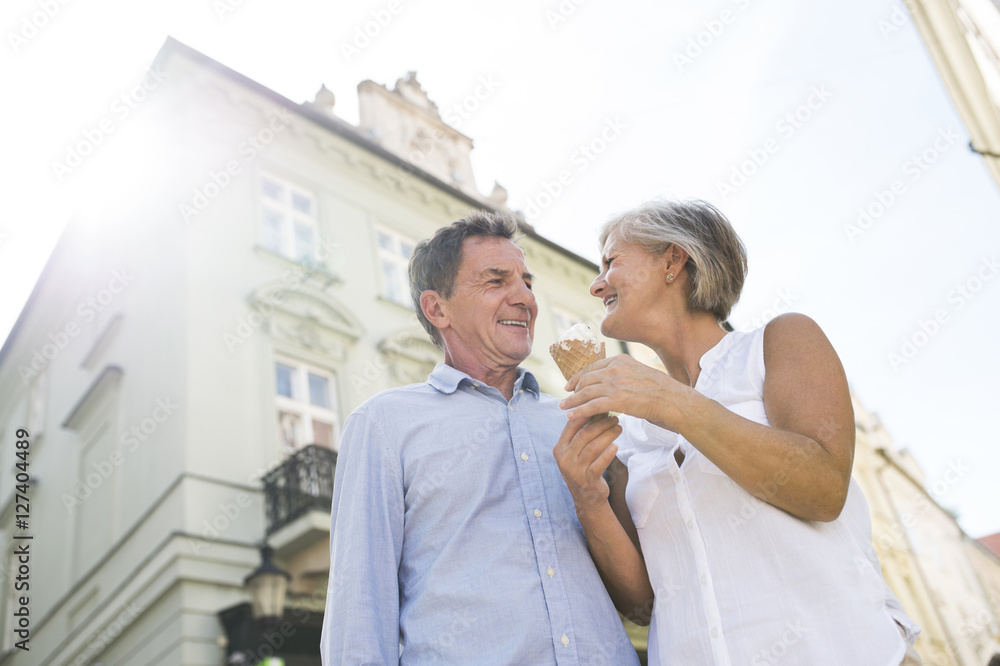 Happy senior couple with ice cream cone Happy senior couple with ice cream cone