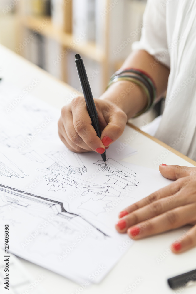 Landscape architect drawing at desk, close-up Landscape architect drawing at desk, close-up