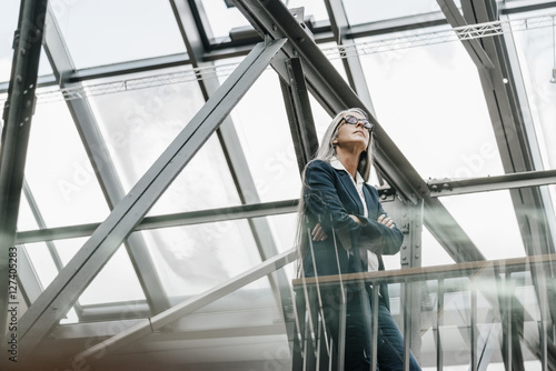 Wallpaper Mural Woman with long grey hair standing in a loft Torontodigital.ca