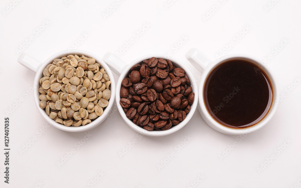Fototapeta premium Three white cups with different stages of coffee: green and roasted beans and ready drink