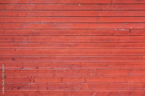 Red rural wooden wall, close-up texture