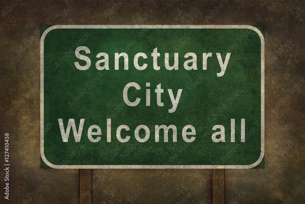 Sanctuary city welcome road sign with ominous background
