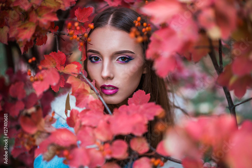beautiful and fashionable girl in the autumn viburnum © stelmaht