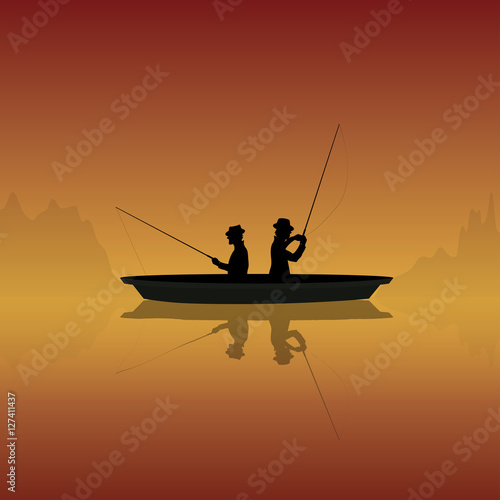 silhouette of fishermen with fishing rods in a boat on a sunset background