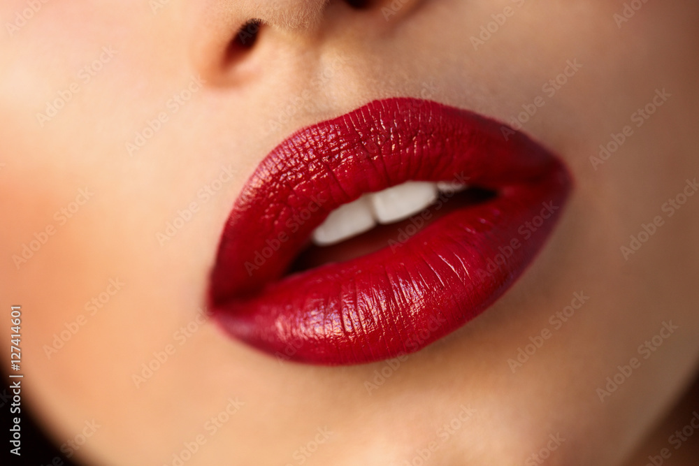 Fototapeta premium Closeup Beautiful Woman Lips With Red Lipstick. Beauty Makeup