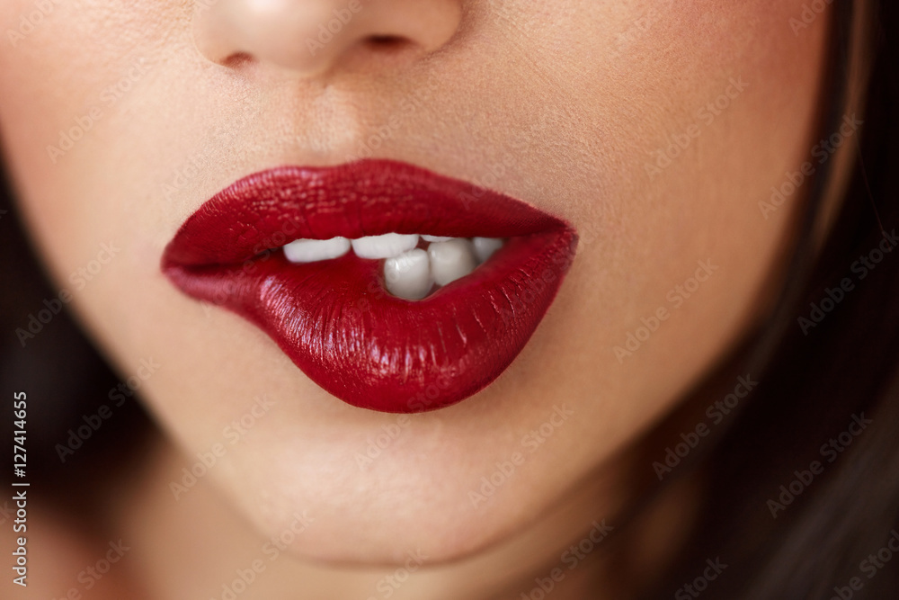 Fototapeta premium Closeup Beautiful Woman Lips With Red Lipstick. Beauty Makeup
