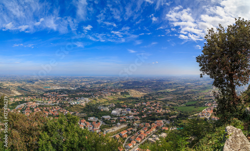 View of San Marino from Monte Titano, summer day, blue sky, light clouds