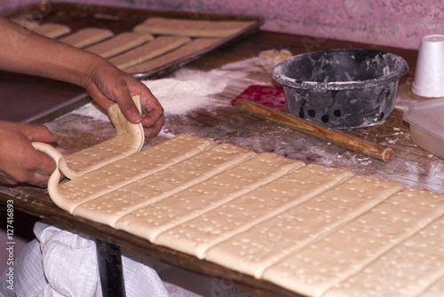 Male hands knead the dough in Guatemala. Chapin bread